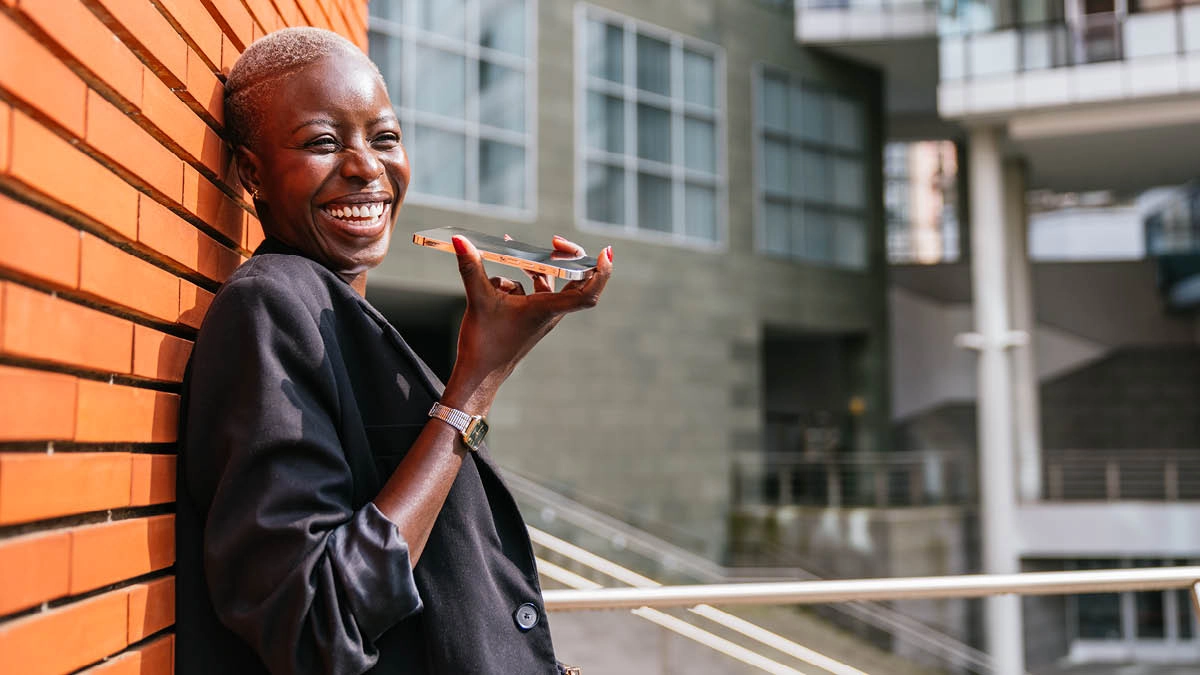 Woman Laughing With Mobile